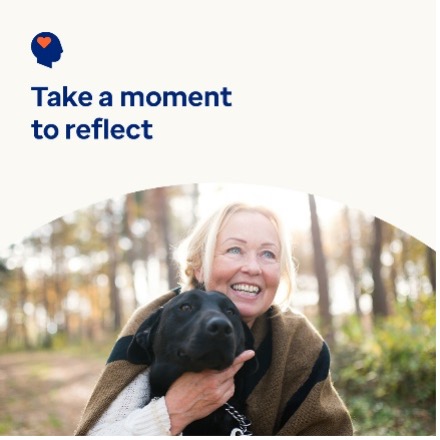 women holding dog with text Take a moment to reflect  